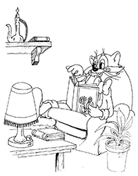 Раскраска Кот Леопольд читает книгу в кресле