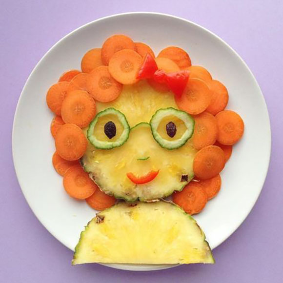 Фруктовый завтрак: портрет девушки из ананасов и моркови