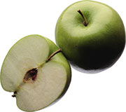 Зеленое яблоко и половинка яблока